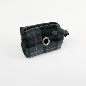 Handmade dog poop bag holder in a charcoal grey tartan print fabric.